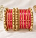 Pink and gold bridal bangle set with pearl-style accents