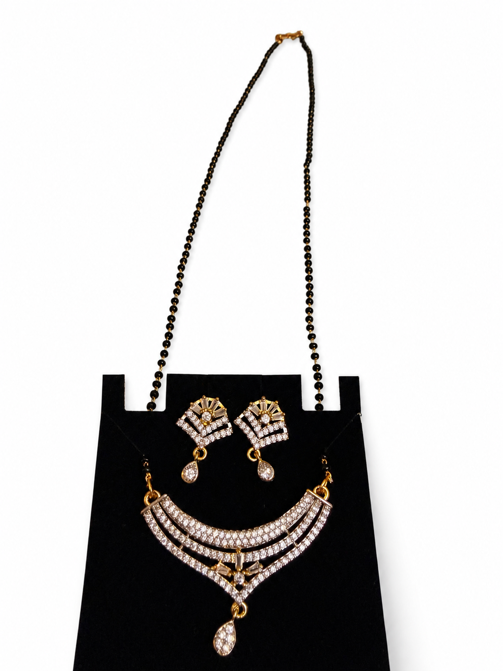 Sparkling mangalsutra necklace and matching earrings detail