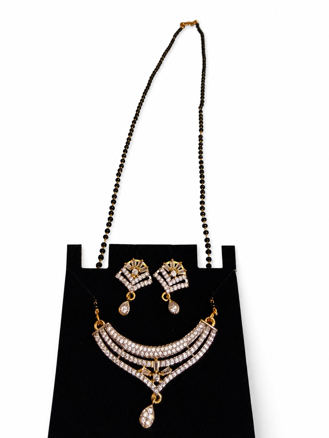 Sparkling mangalsutra necklace and matching earrings detail