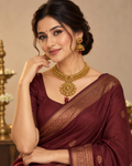 Antique gold temple-inspired necklace and jhumka set
