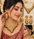 Gold-tone traditional necklace and earrings set with red green and pearl accents